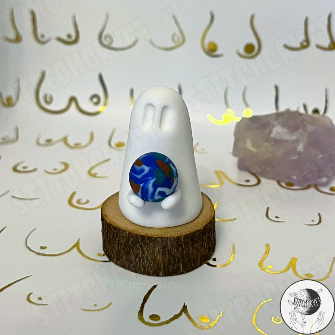 Ghost holding tiny planet earth  | Limited small batch