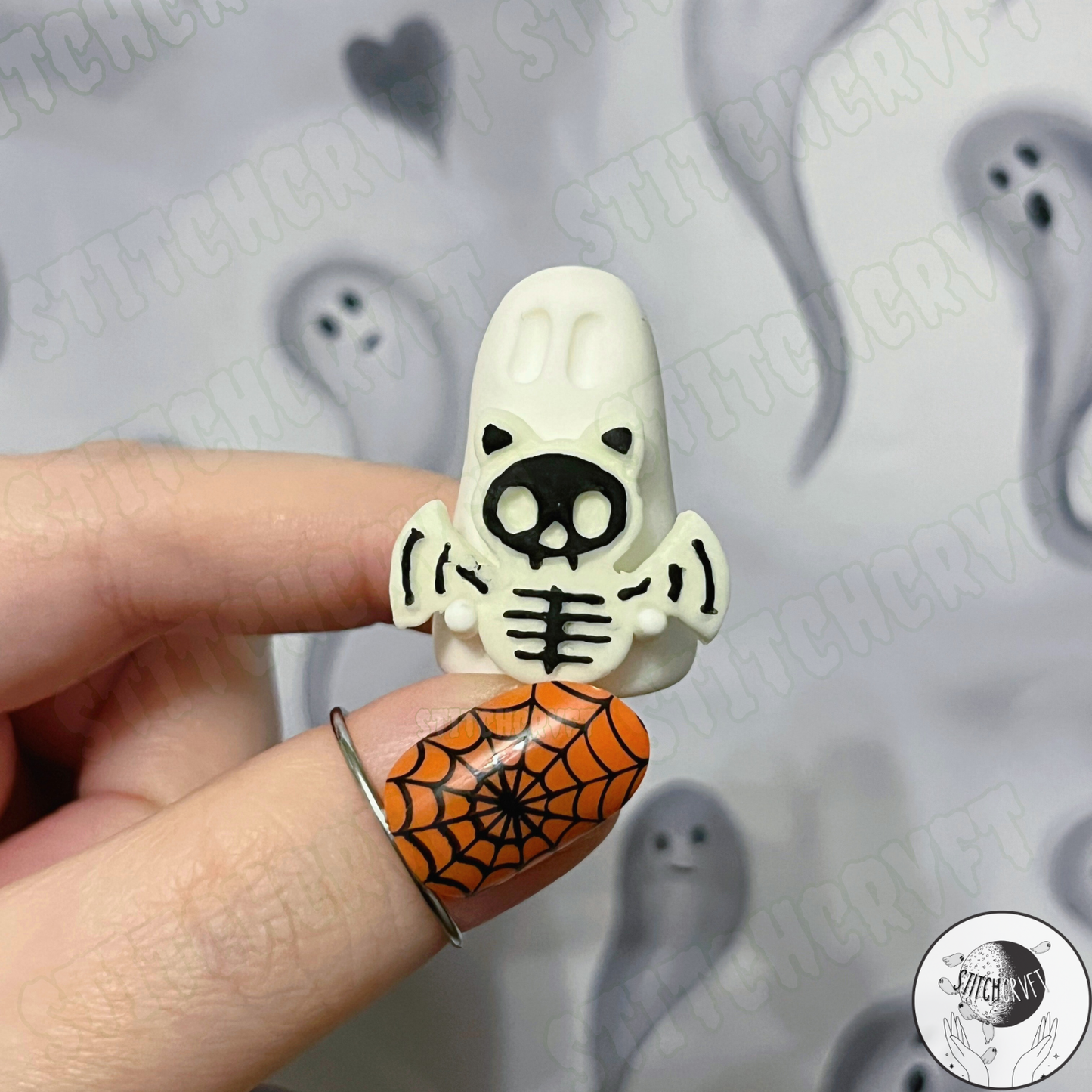 Ghost holding glowing skelebat | Handmade to order