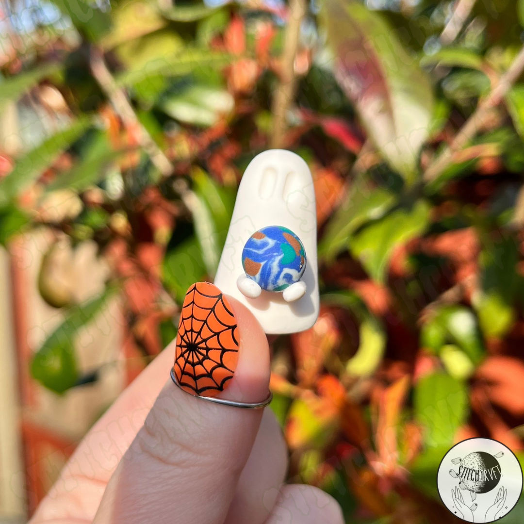 Ghost holding tiny planet earth  | Limited small batch