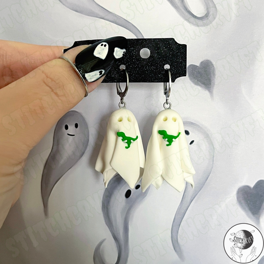 Sheet ghost earrings holding tiny trex with glowing eyes | Handmade to order