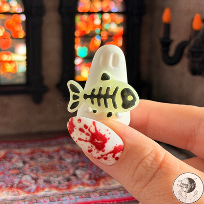 Ghost holding glowing skeleton fish | Handmade to order
