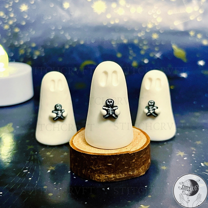 Ghost holding tiny goth gingerbread figure | Handmade to order