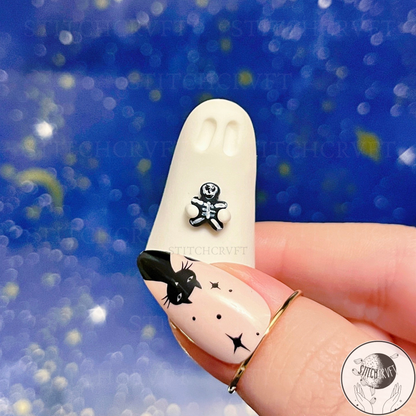 Ghost holding tiny goth gingerbread figure | Handmade to order