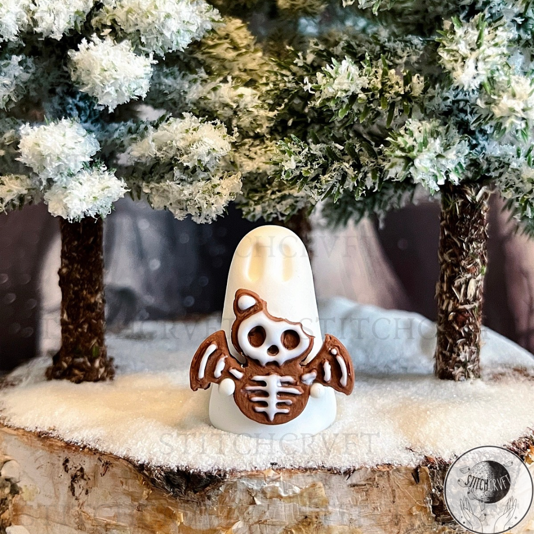 Ghost holding tiny gingerbread skelebat | Handmade to order