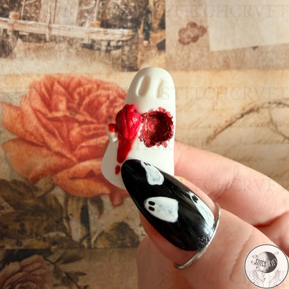 Ghost holding carved out anatomical heart | Handmade to order