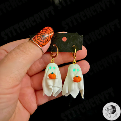 Sheet ghost earrings holding tiny pumpkin with glowing eyes | Handmade to order