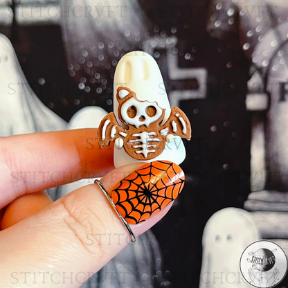 Ghost holding tiny gingerbread skelebat | Handmade to order