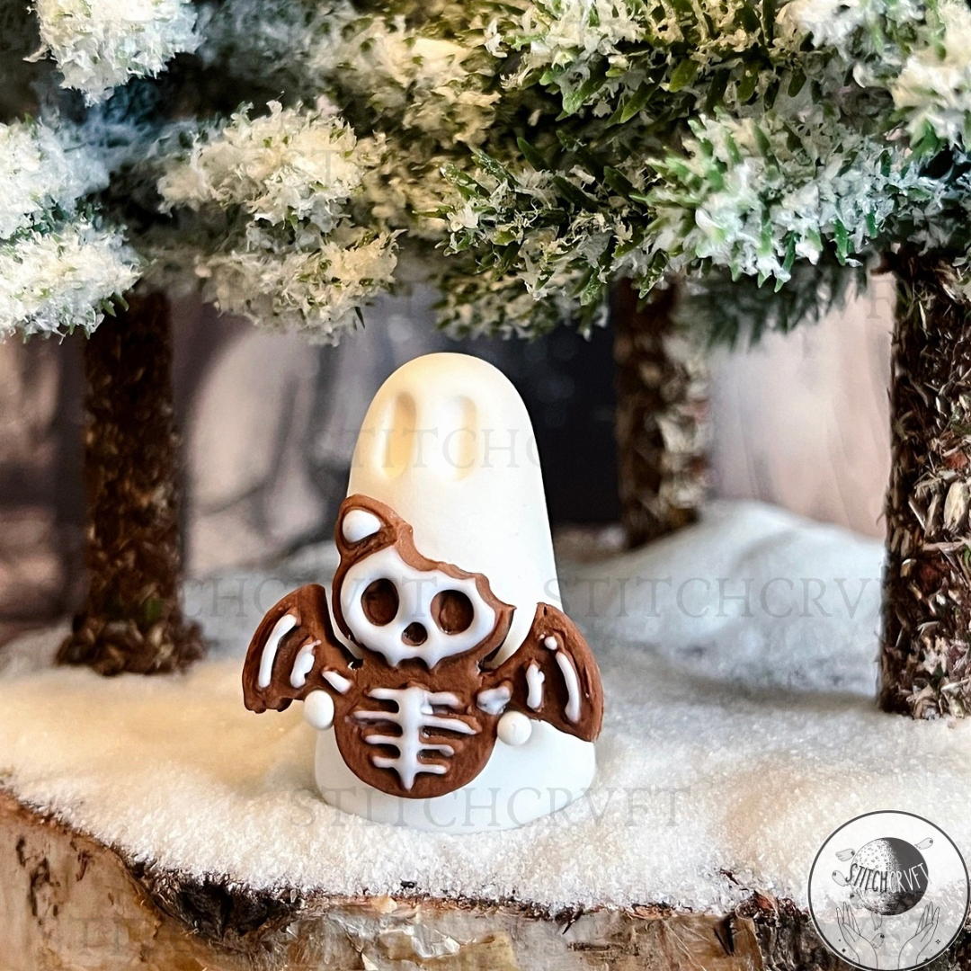 Ghost holding tiny gingerbread skelebat | Handmade to order