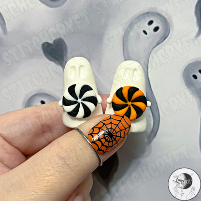 Ghost holding tiny spooky swirl candy | Handmade to order