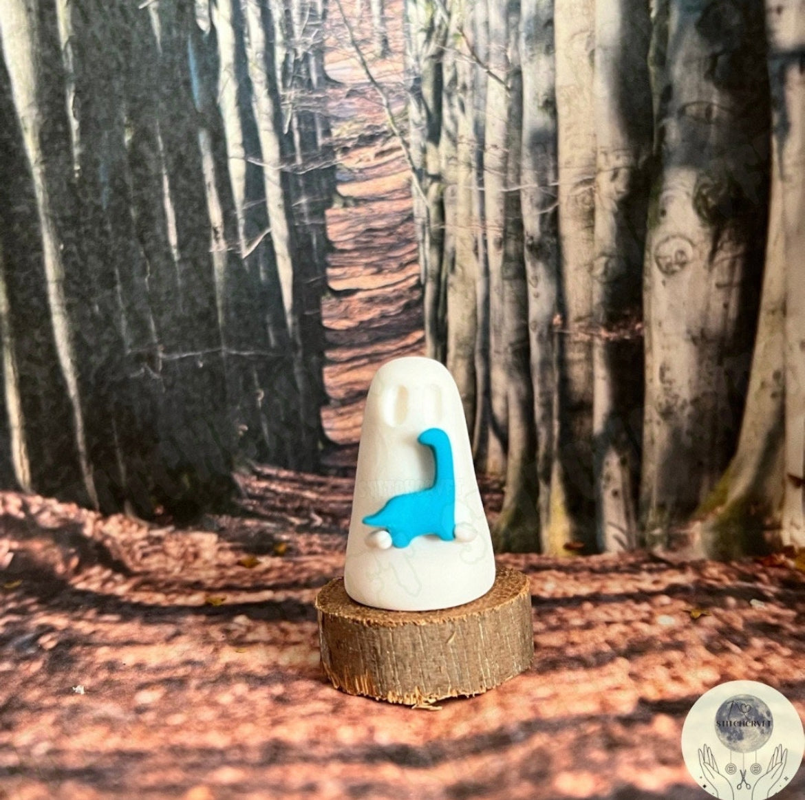 Ghost holding tiny brontosaurus | Handmade to order