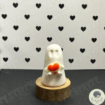 Ghost holding tiny glow heart planet | Handmade to order