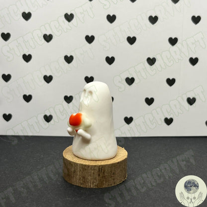 Ghost holding tiny glow heart planet | Handmade to order